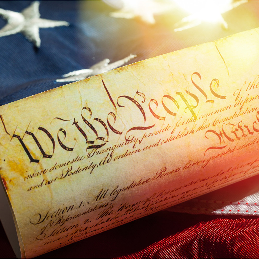 image of the constitution on american flag background