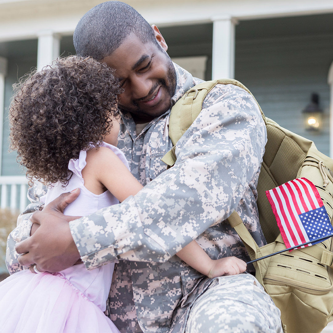 U.S. Soldier embracing daughter